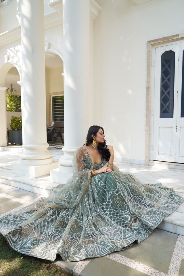 Green Heavy Embroidery Net Semi Stitch A Line Lehenga With Blouse