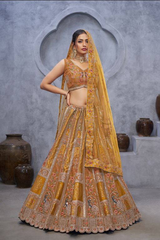 The bagh collection: Marvelous Mustard with peacock Embroidered bridal lehenga