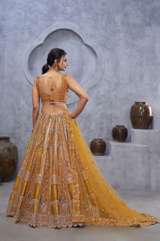The bagh collection: Marvelous Mustard with peacock Embroidered bridal lehenga