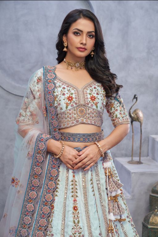 Stunning sky blue Lehenga with Zari Paisley Embroidery, Silk Patches, and Regal Peacock Motifs