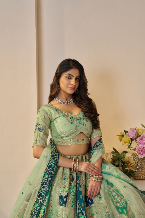 The Rajsi Haathi Collection: Graceful Reeen with peacock Embroidered bridal lehenga