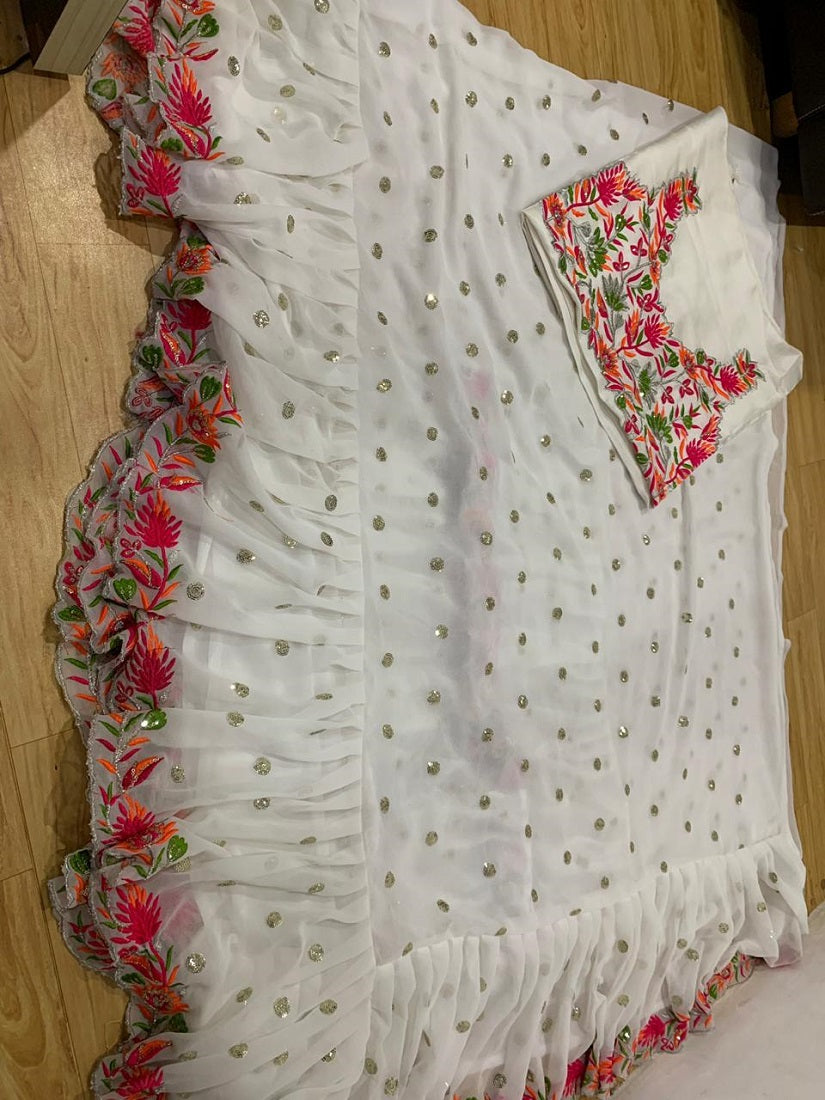 White Faux Georgette With Embroidered Sequence Work Ruffle Saree With Unstitched Blouse