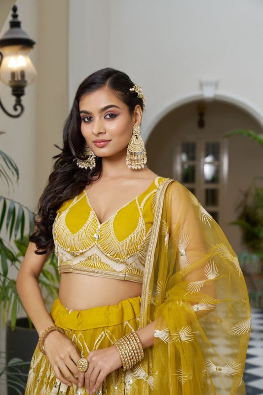 Yellow Heavy Embroidery Net Semi Stitch A Line Lehenga With Blouse