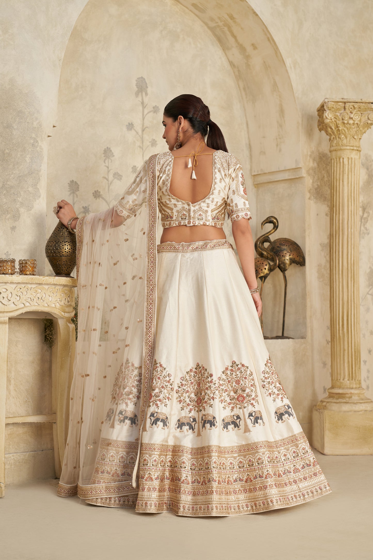 White Lehenga with Intricate Elephant Zari Work