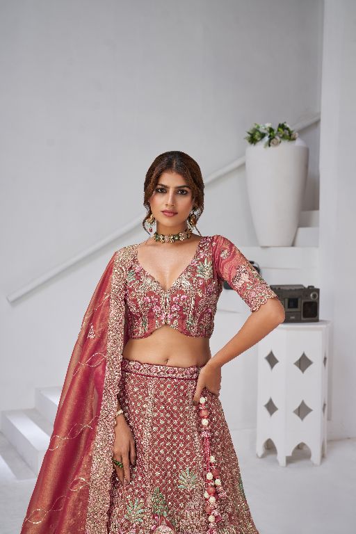 Traditional  dark Pink Bridal Lehenga Featuring Auspicious Cow and Temple Motifs