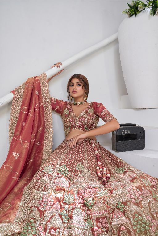 Traditional  dark Pink Bridal Lehenga Featuring Auspicious Cow and Temple Motifs