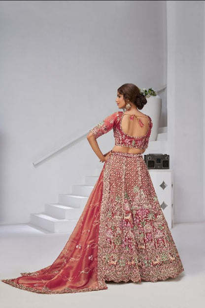 Traditional  dark Pink Bridal Lehenga Featuring Auspicious Cow and Temple Motifs