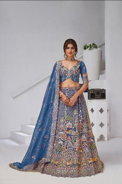 Teal Blue Raw Silk Bridal Lehenga Featuring Temple, Cow & Floral Embroidery