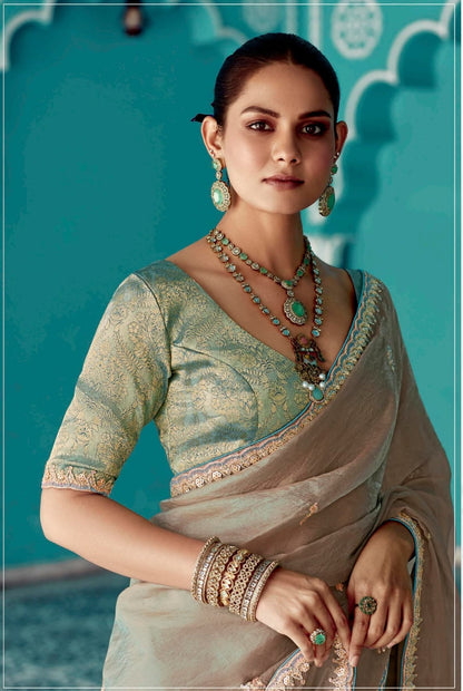 Cream embroidery work saree with jacquard work blouse piece
