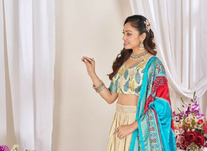 Cream patola print dola silk semi stitched lehenga choli with tassels