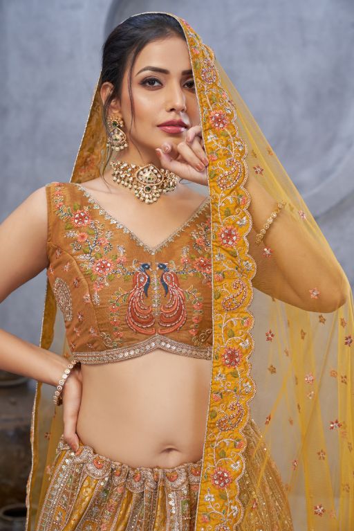 The bagh collection: Marvelous Mustard with peacock Embroidered bridal lehenga