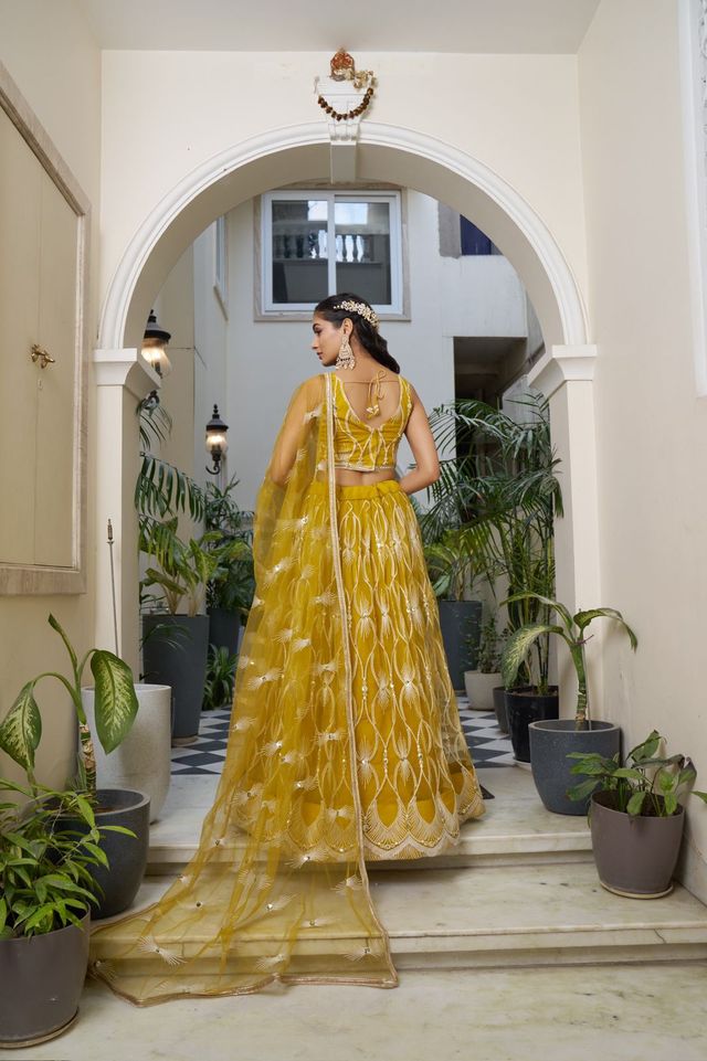 Yellow Heavy Embroidery Net Semi Stitch A Line Lehenga With Blouse