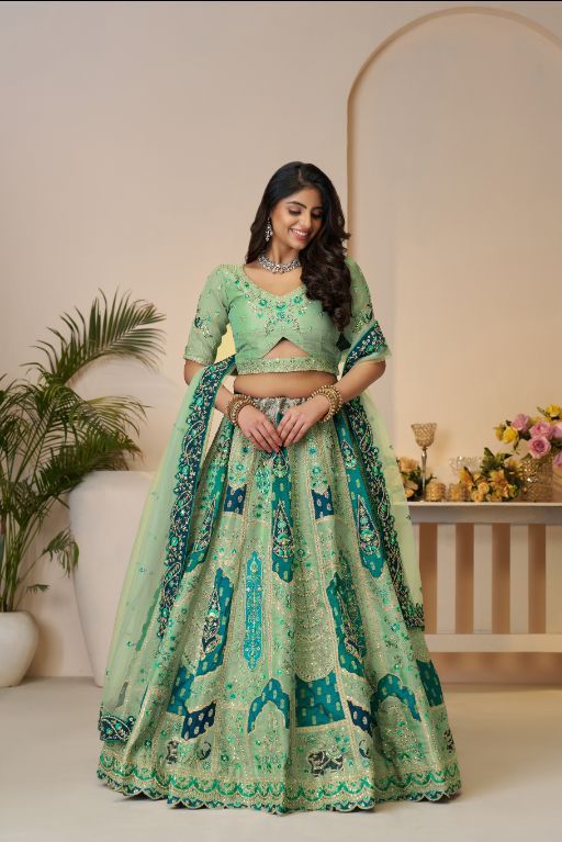The Rajsi Haathi Collection: Graceful Reeen with peacock Embroidered bridal lehenga