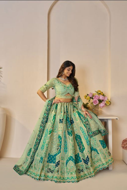 The Rajsi Haathi Collection: Graceful Reeen with peacock Embroidered bridal lehenga