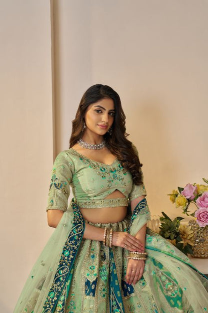 The Rajsi Haathi Collection: Graceful Reeen with peacock Embroidered bridal lehenga