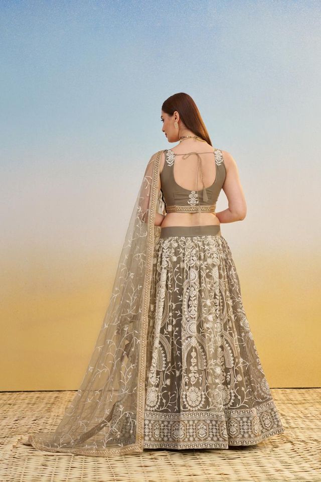 Ivory Heavy Embroidery Net Semi Stitch A Line Lehenga With Blouse