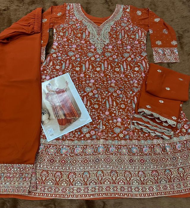 Orange pure geogette full stitched suit Free Size upto 42