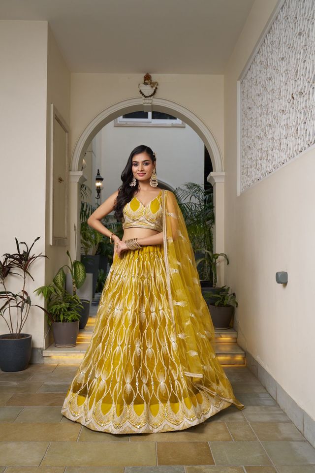 Yellow Heavy Embroidery Net Semi Stitch A Line Lehenga With Blouse
