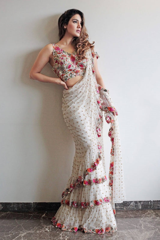 White Faux Georgette With Embroidered Sequence Work Ruffle Saree With Unstitched Blouse