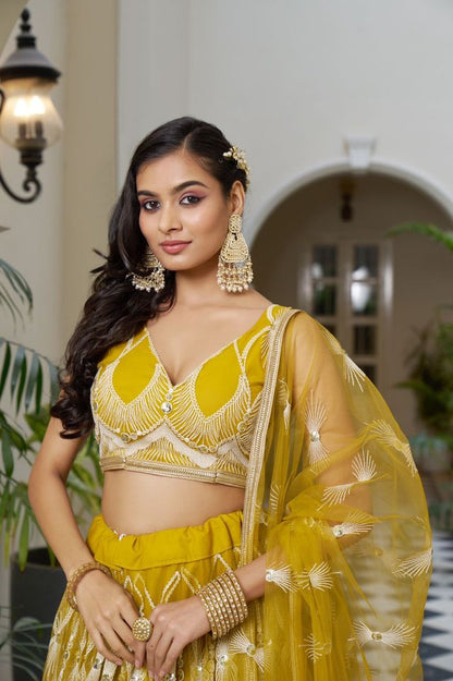 Yellow Heavy Embroidery Net Semi Stitch A Line Lehenga With Blouse